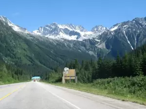 Rogers Pass Summit Sign With Mountains (Mark Ruthenberg)